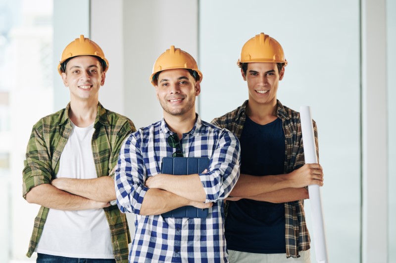 Horizontal,Medium,Shot,Of,Three,Professional,Engineers,Wearing,Checked,Shirts